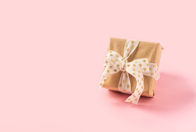 Gift or present box on pink