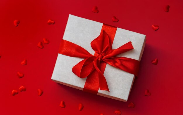 Gift on a red background Selective focus Holiday