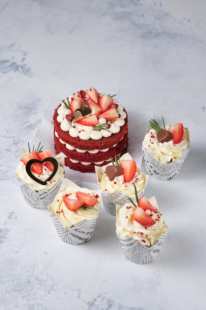 Gift set for the holiday Red velvet bento cake with fresh strawberries and red velvet cupcakes with strawberries chocolate and cream cheese cream