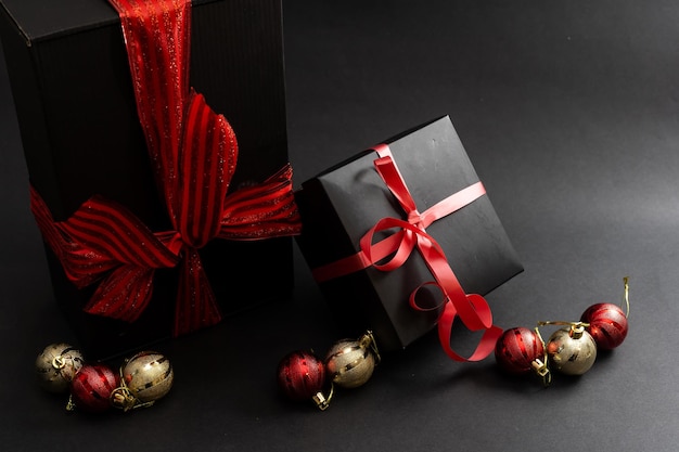 Gift with a red ribbon. Black gift box