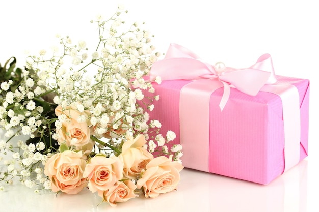 Giftbox and flowers isolated on white surface