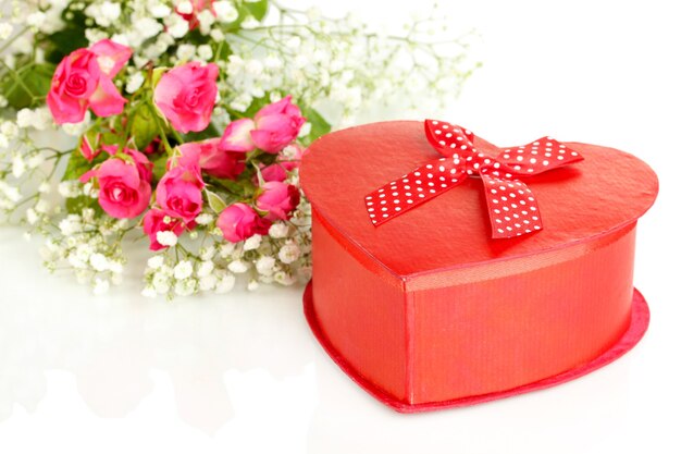 Giftbox and flowers isolated on white