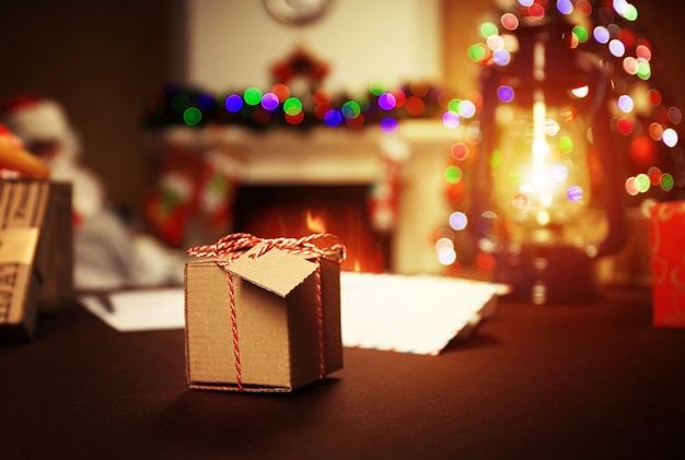 Gifts under the Christmas tree lights surface