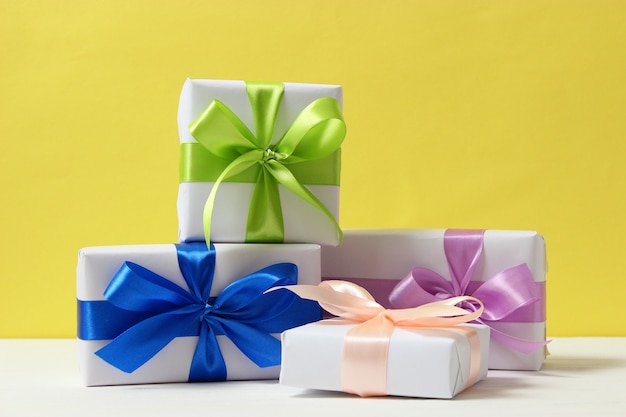 Gifts on a colored background holiday giving presents birthday