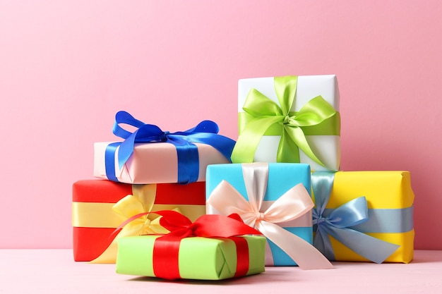 Gifts on a colored background top view holiday giving presents birthday