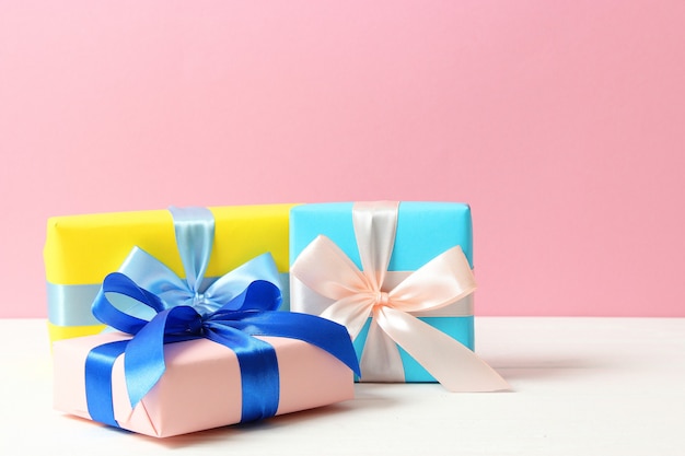 Gifts on a colored background top view holiday giving presents birthday