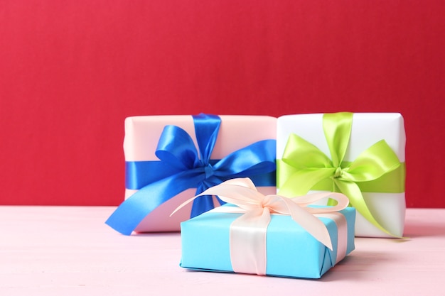 Gifts on a colored background top view holiday giving presents birthday