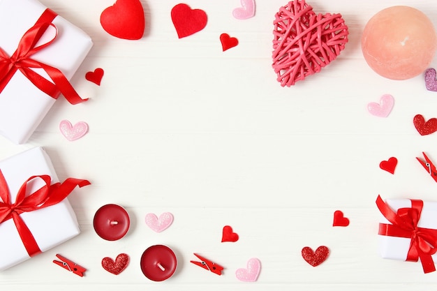 gifts and hearts on a colored background top view love