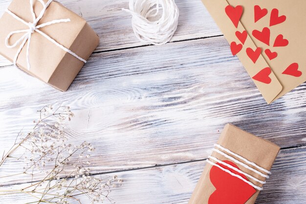 Gifts packed in craft paper, envelope, rope, paper hearts