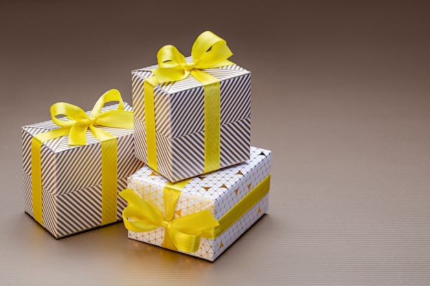 Gifts in shiny packaging for various holidays and events. Close-up,