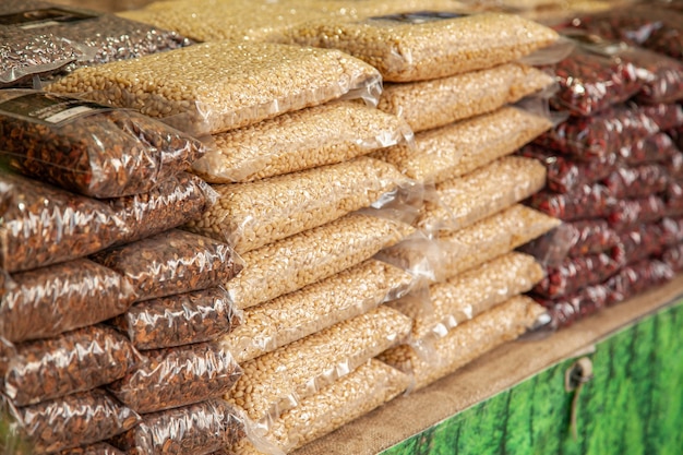 Gifts of the Taiga. Packages with pine nuts, pine nut shells, cranberries at a rural fair.