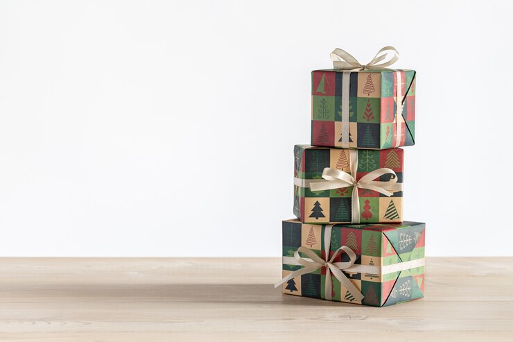 Photo gifts in three vertical boxes, wrapped in paper with christmas