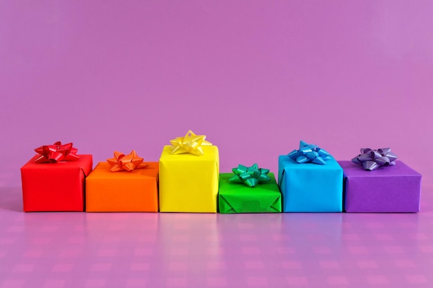 Gifts with the colors of LGBT on pink background