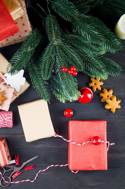 Gifts wrapped in craft paper and decorated with homemade gingerbread cookies