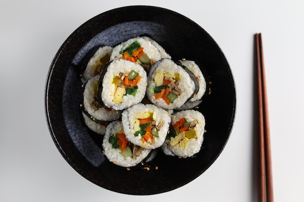 Gimbap or kimbap is a Korean food made from steamed white rice and various other ingredients