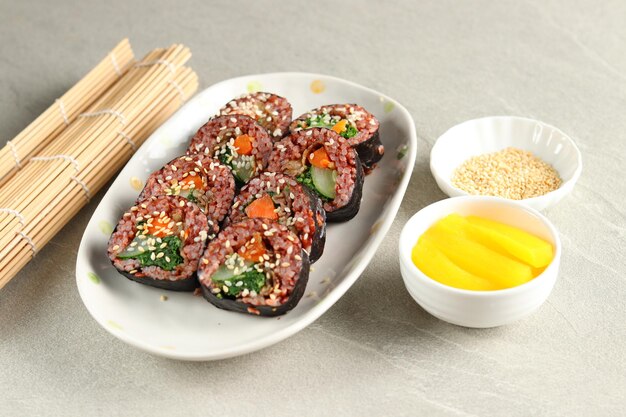 Gimbap or kimbap is a Korean food made from steamed white rice and various other ingredients