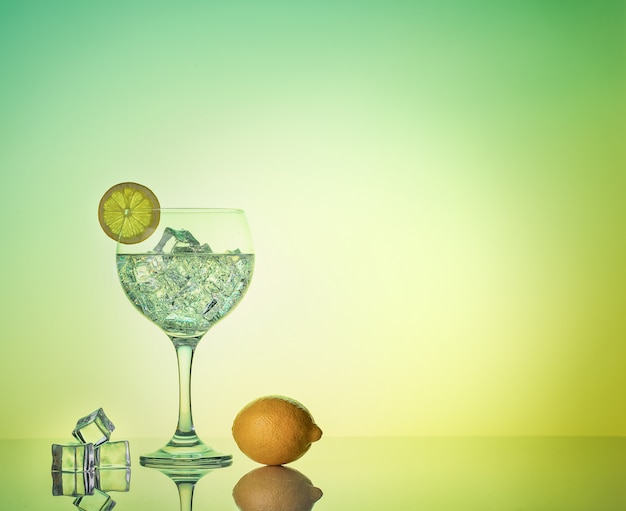 Gin tonic cocktail with lemon and ice