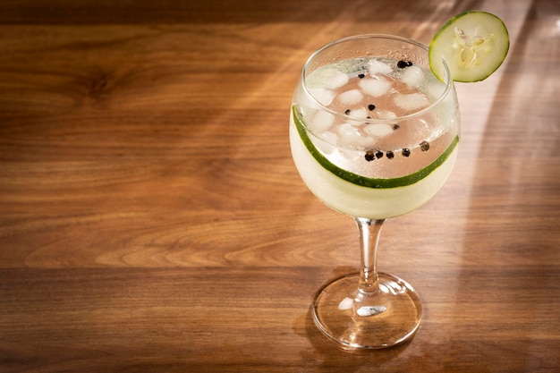 Gin Tonic garnished with cucumber