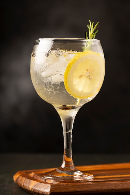 Gin Tonic garnished with lemon and rosemary