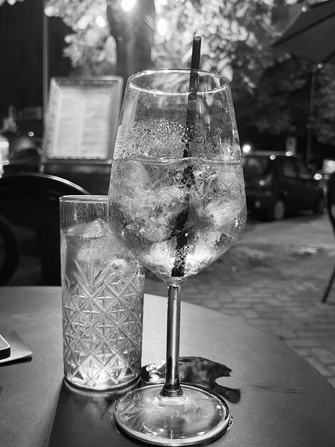 Gin tonic in a glass with ice rocks Copy paste black and white photo