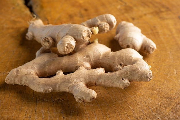 Ginger, commonly used ginger root in Brazil on rustic wood, selective focus.