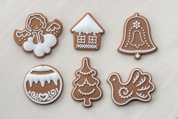 Ginger cookies on light wooden table as surface