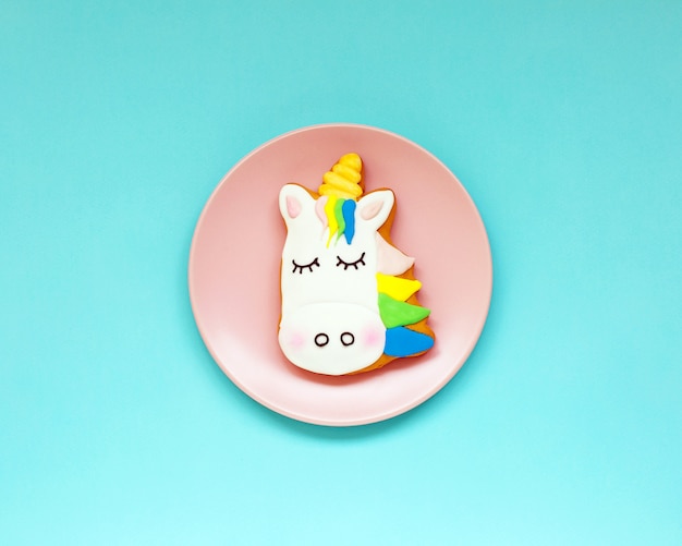 Ginger cookies in the shape of a Unicorn on geometric pastel paper