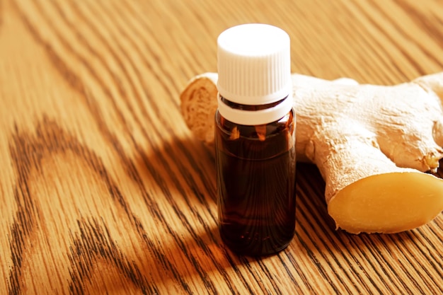 Ginger essential oil in a small bottle selective focusnature