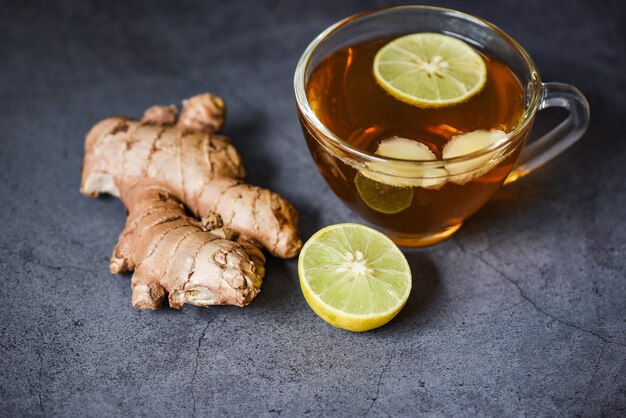 Ginger and lemon fresh cocktail, Hot Ginger juice in glass and ginger root herbal juice