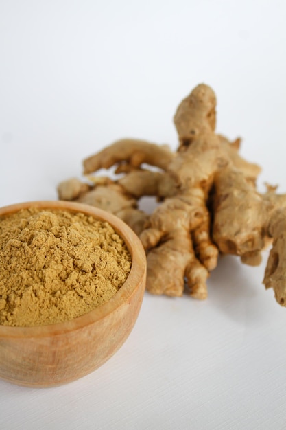 Ginger raw and powder in the wooden basket