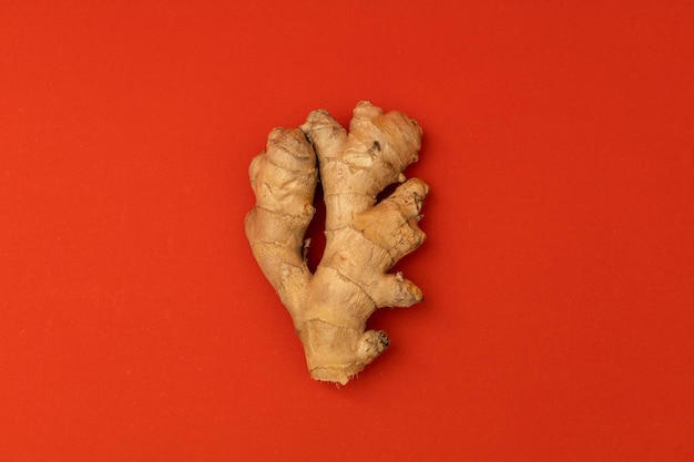 Ginger root on a red background