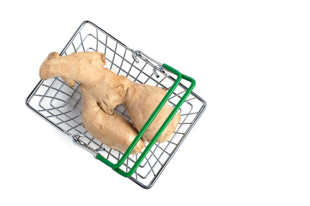 Ginger root in a shopping basket on a white background.