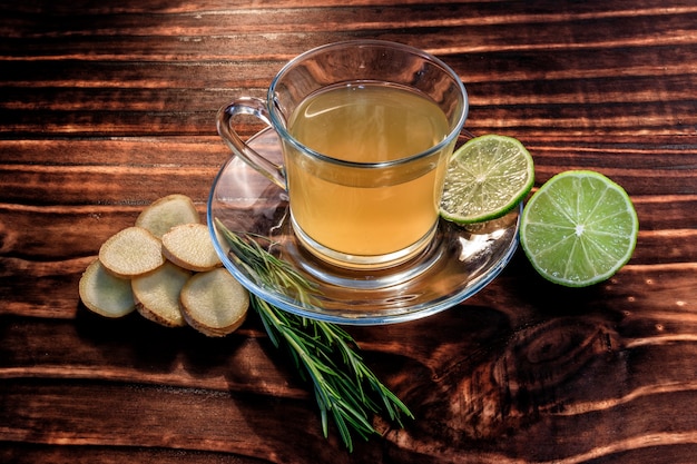 Ginger tea over dark wood