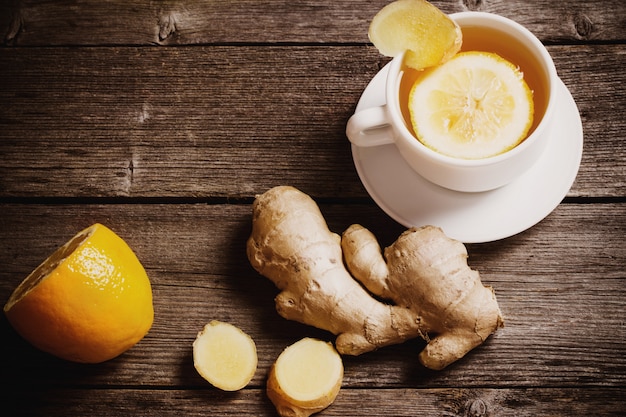 Ginger tea with lemon in a white cup