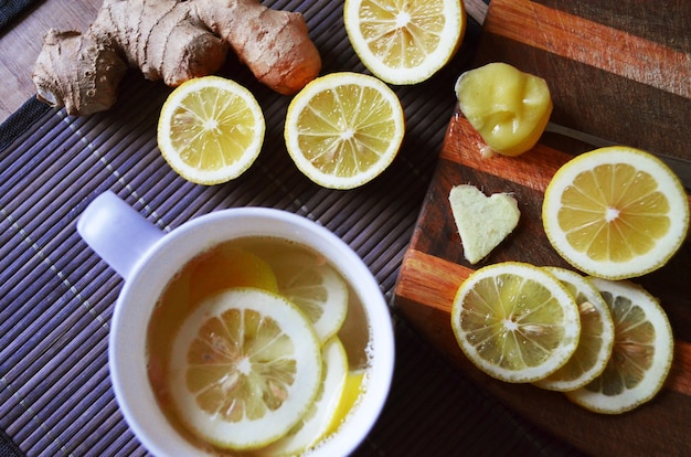 Ginger tea with lemon in a white cup