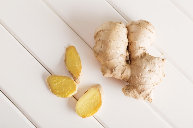 Ginger on white wooden background