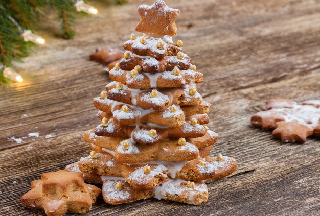 Gingerbread christmas tree cookies on wooden