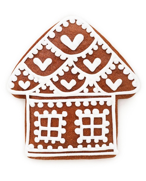 Foto gingerbread cookie house vormige kerstversiering geïsoleerd op wit