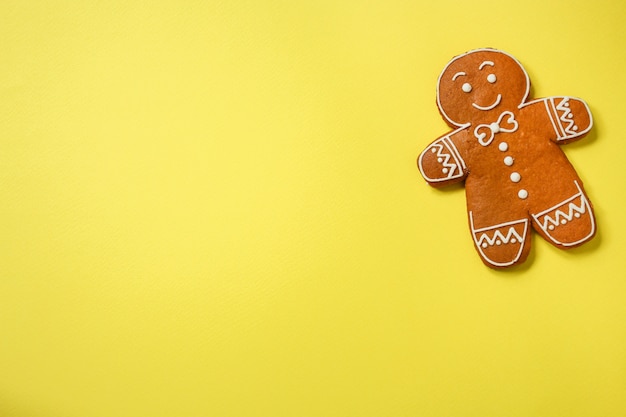 gingerbread cookie man on yellow background