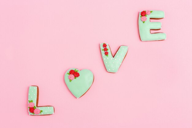 Gingerbread cookies in shape of love word with icing