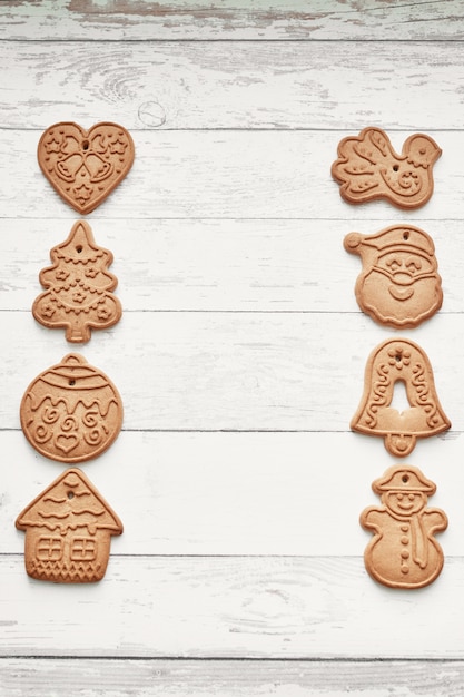 Gingerbread cookies on white wood