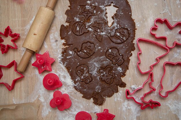 Gingerbread dough for christmas cookies and cookie cutters