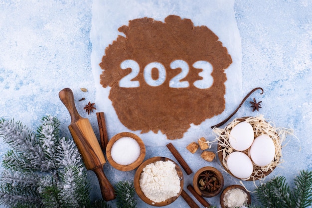 Gingerbread dough for cookies in shape of 2023