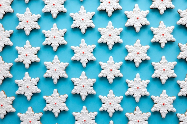 Gingerbread in the form of snowflakes on a blue background