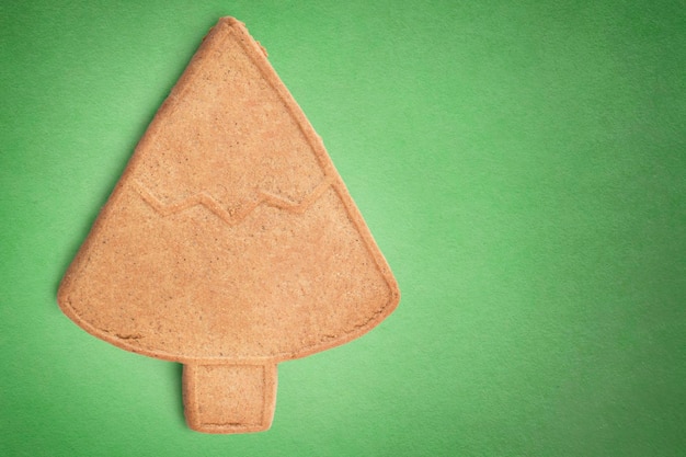 Gingerbread on green background