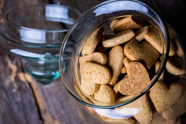 Gingerbread in heart shape in a glass jar