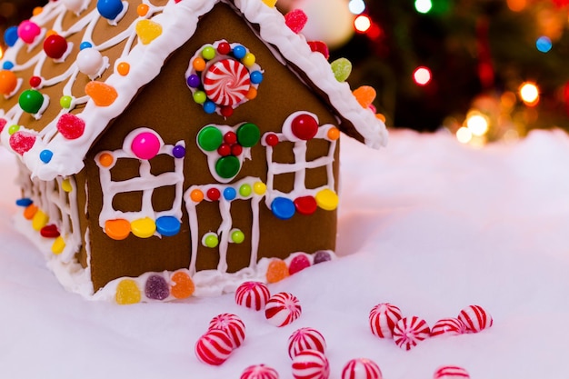 Gingerbread house with round  peppermint candies.