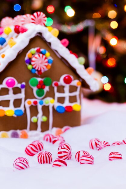 Gingerbread house with round  peppermint candies.