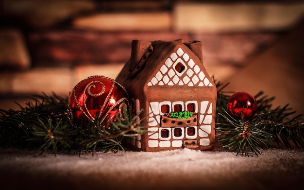 Gingerbread houseChristmas balls the concept of the celebrati