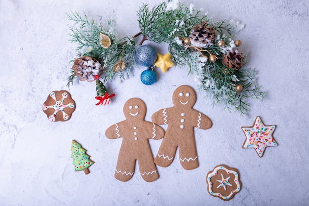 Gingerbread men and figures. Traditional New Year and Christmas homemade cookies. Christmas background. Selective focus, close up.